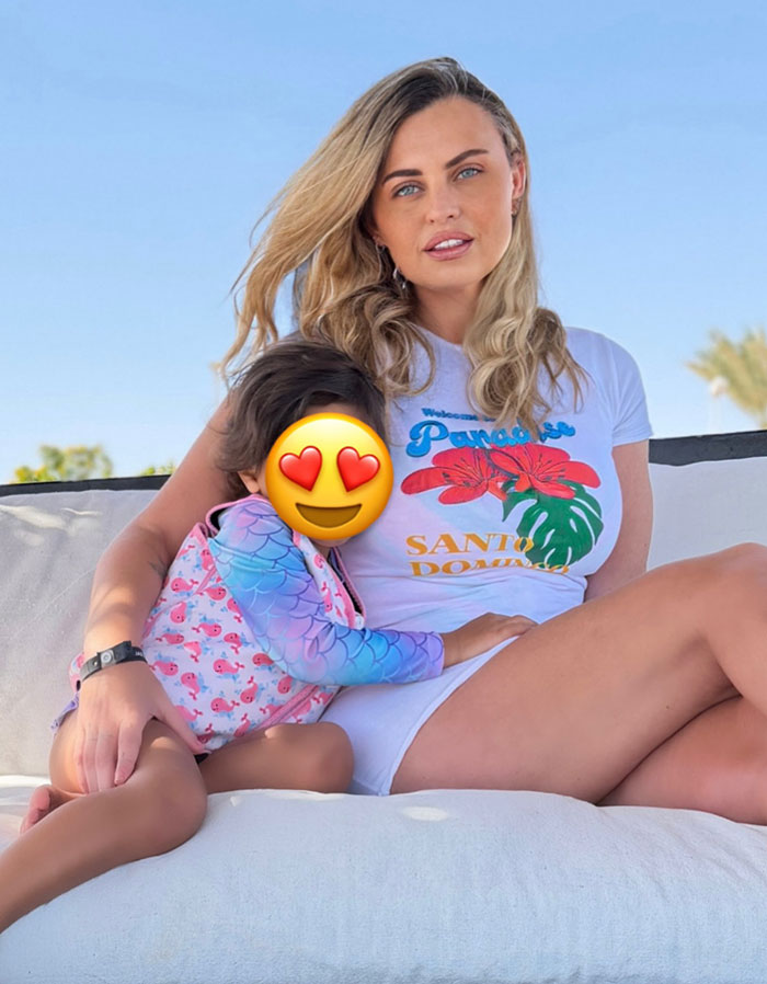 Woman known as Britain&rsquo;s most hated, sitting with child outdoors, highlighting harrowing diagnosis after faking depression for nose job.