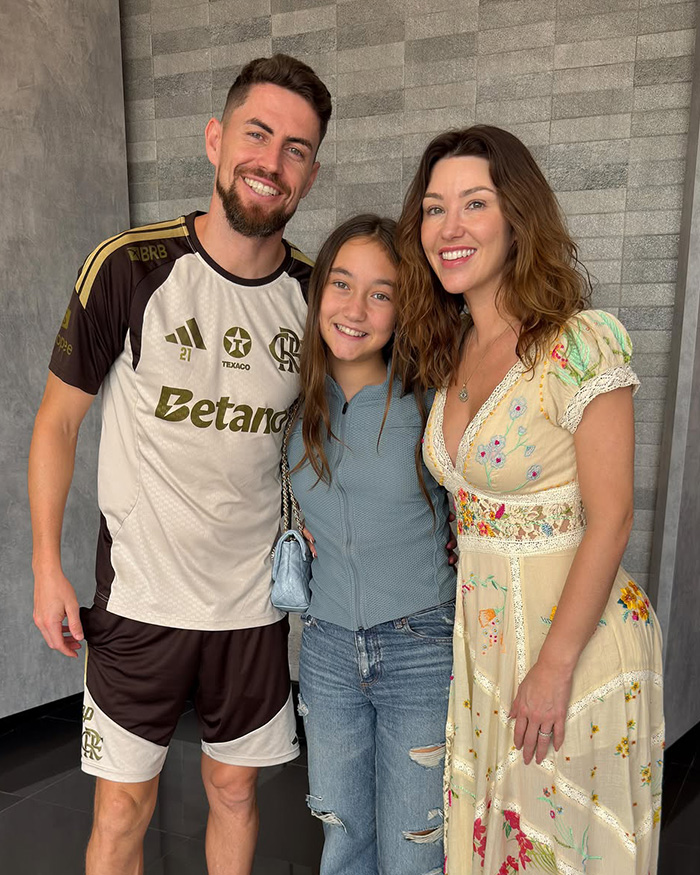 Family posing together indoors, highlighting Chappell Roan and fan interaction amid security concerns. Family posing together indoors, highlighting Chappell Roan and fan interaction amid security concerns.