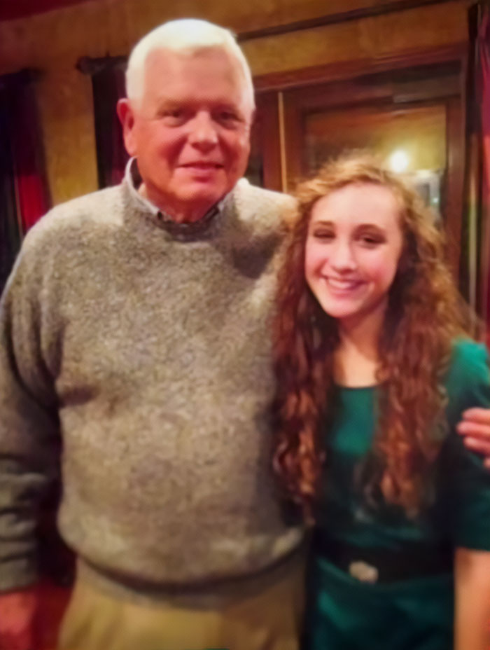 Older man and young woman smiling together indoors, related to Chappell Roan’s background and security guard treatment.