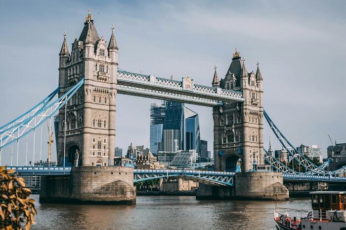 Tower Bridge in London with modern skyscrapers in the background, illustrating popular myths about iconic landmarks worldwide.