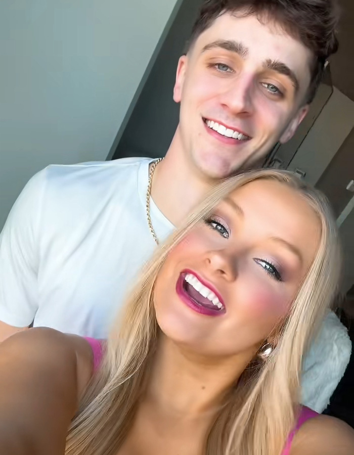 Young couple smiling indoors, highlighting cheerleader Laken Snelling&rsquo;s Snapchat history linked to her newborn&rsquo;s passing.