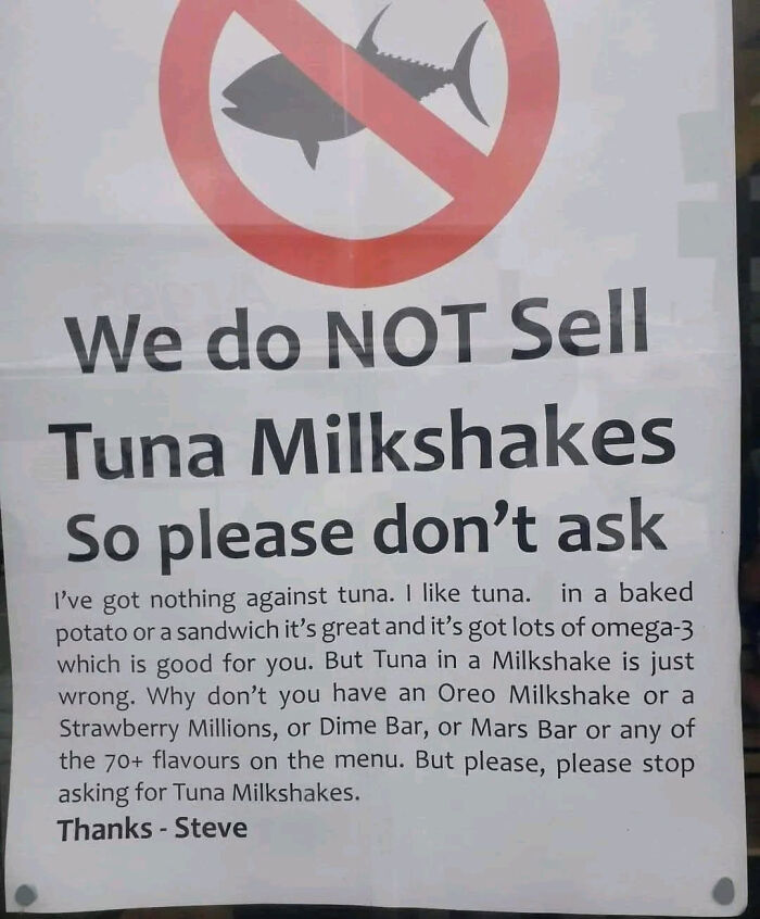 Funny sign humorously refusing to sell tuna milkshakes, making people laugh or do a double take