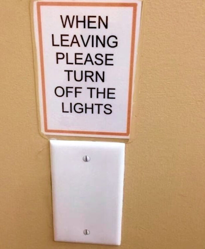 Sign above a blank light switch plate saying please turn off the lights, one of the funny signs that made people laugh or do a double take.