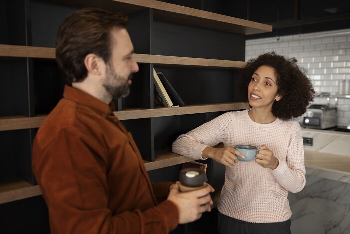 Man and woman having a conversation over coffee, illustrating moments of mansplaining in everyday interactions.