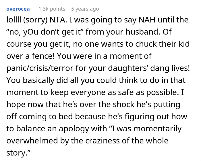 Wife and twin girls running by fence while being chased by a dog in a tense outdoor moment.