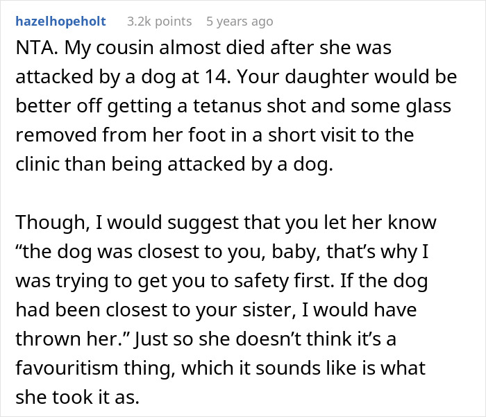 Wife protecting twin girls near a fence while being chased by a dog in a backyard setting.