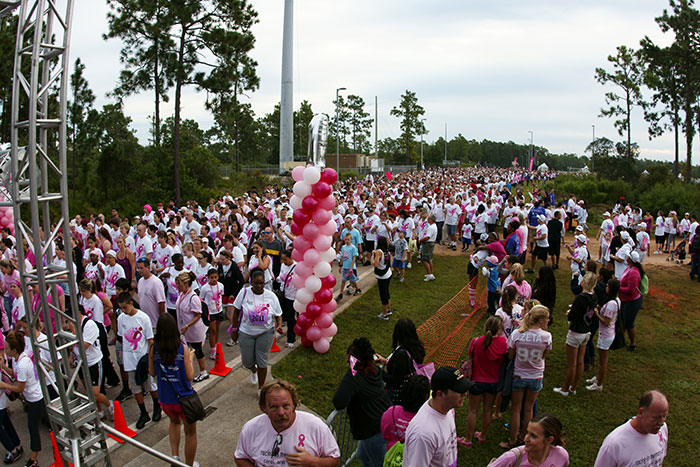 Large crowd gathered outdoors for an event, illustrating the scale of businesses often more corrupt than people know.