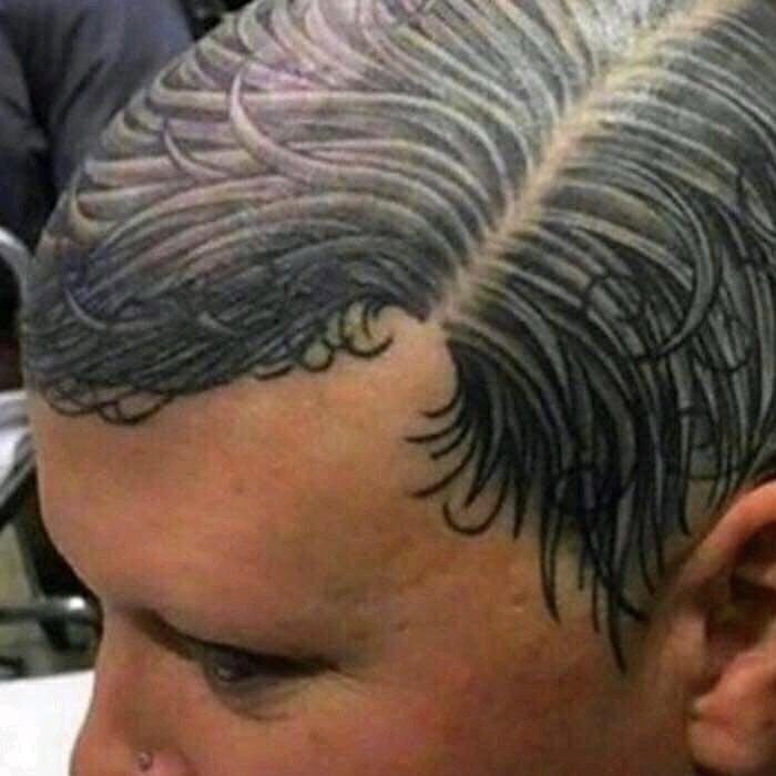 Close-up of a person's head with a weird and cringey tattoo that mimics hair strands on the scalp.