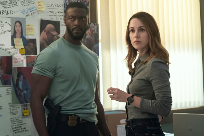 Two detectives in an office with a suspect board, scene representing Prime Video&rsquo;s Cross streaming success.