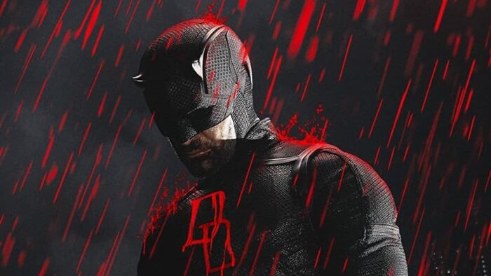 Daredevil in black suit with red accents standing in heavy rain, representing Daredevil Born Again Season 2 release details.