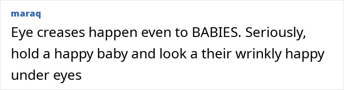 Close-up of a happy baby showing natural eye creases that contribute to the appearance of tired eyes despite youthful features.