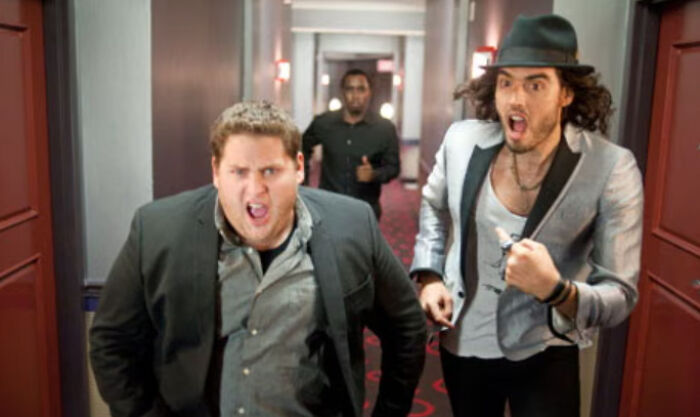 Two celebrities running down a hallway with intense expressions, illustrating changing feelings about celebrities.