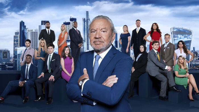 Group of diverse professionals with a confident man in front, representing celebrities people used to like but now hate.