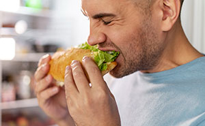 Heavy Eater Consumes 3+ Feet Of Sandwich, Angry Party Host Asks Him To Get Help