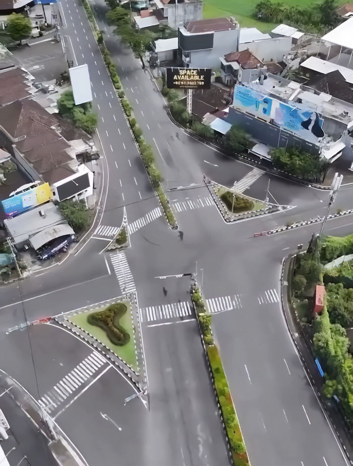 Empty street intersection in Bali during shutdown, illustrating the consequences faced by American tourists going out in public.