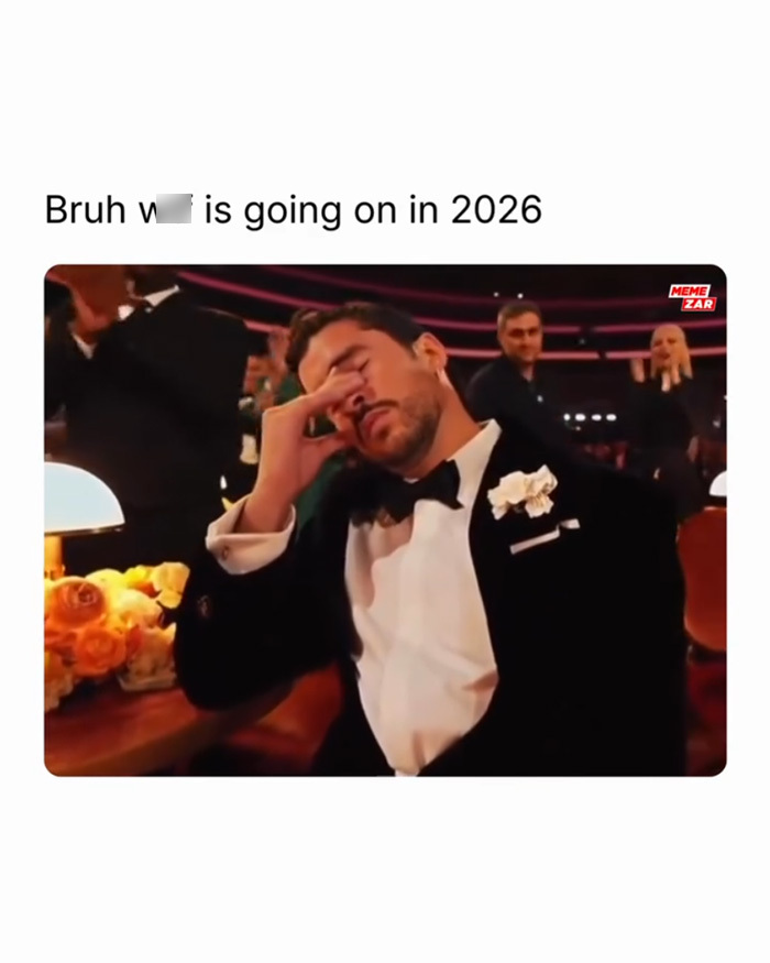 Man in a tuxedo with a flower on his lapel looking stressed, caption referencing WW3 angst in 2026 meme format.
