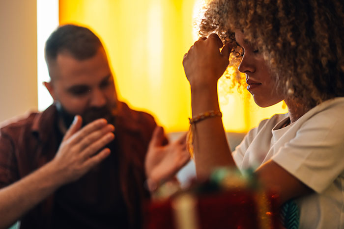 Couple experiencing a tense moment on a first date, highlighting the theme of first dates and character-building trauma.