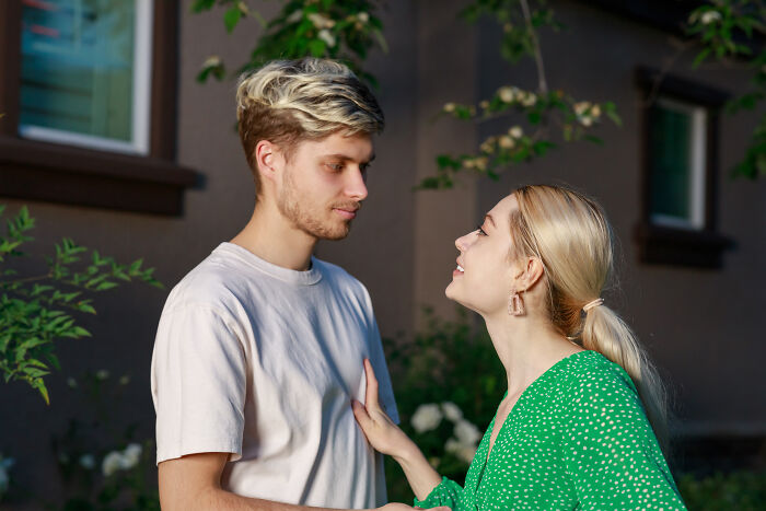 Young man and woman sharing a heartfelt moment outdoors, symbolizing change and connection after loneliness in ex incels.