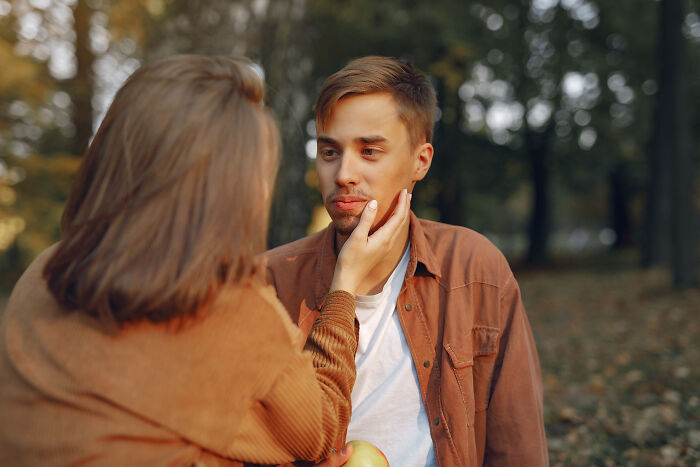 A young couple shares a tender moment outdoors, illustrating themes of connection and change in ex incels stories.