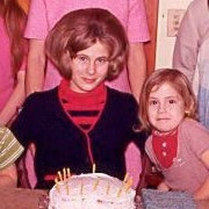 Childhood photo showing children with hair disasters, including an exaggerated voluminous hairstyle and awkward cuts.