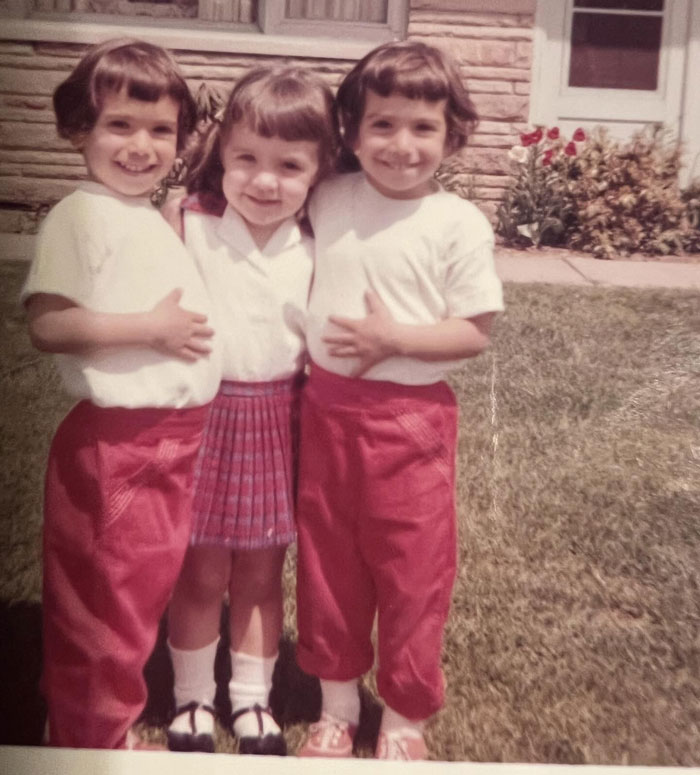 Three children standing outside showing childhood hair disasters with mismatched hairstyles and outfits from the past.