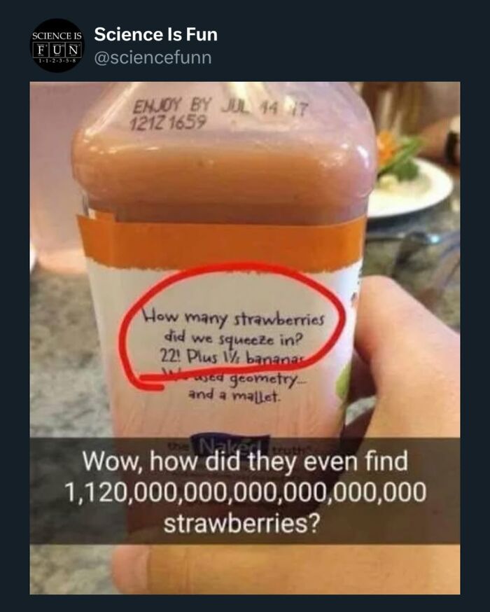 Hand holding a juice bottle labeled with a joke about squeezing 1,120,000,000,000,000,000 strawberries, science memes content.