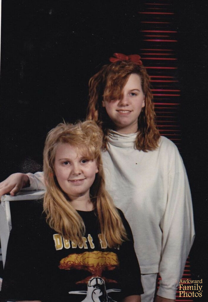Two girls with quirky hairstyles posing awkwardly for a funny school picture day fails photo.