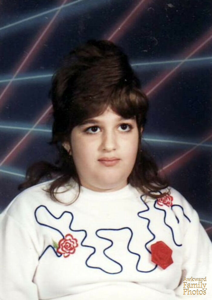 School picture day fail with vintage laser background and unusual hairstyle, capturing a timeless funny school moment.
