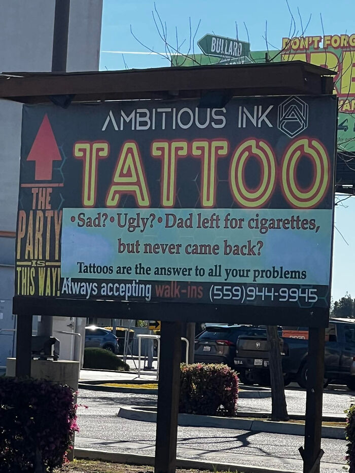 Funny tattoo shop sign with a humorous message making people laugh or do a double take in public.