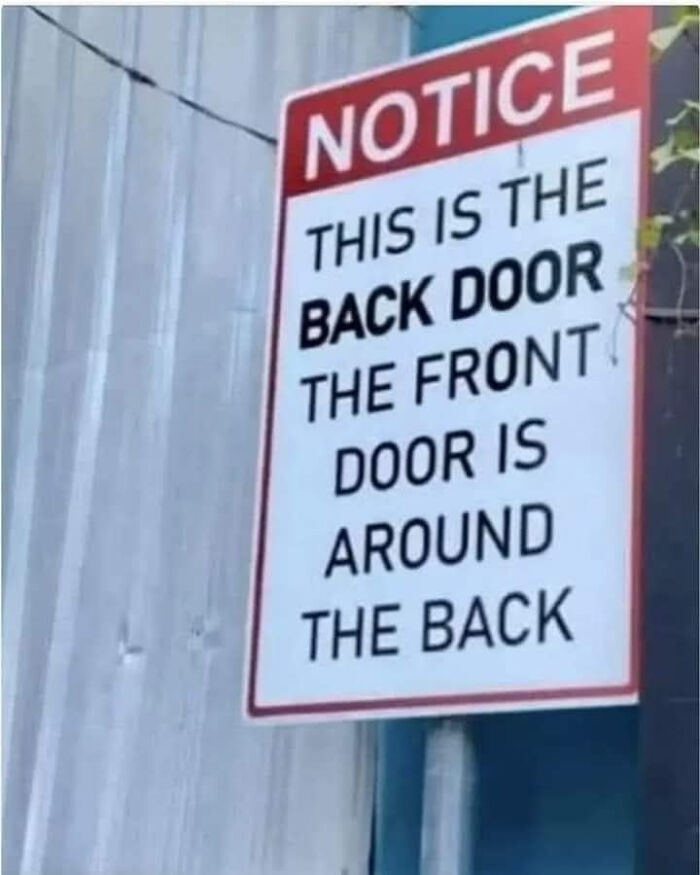 Sign with notice about the back door being at the front, a humorous example from signs that made people laugh or do a double take.