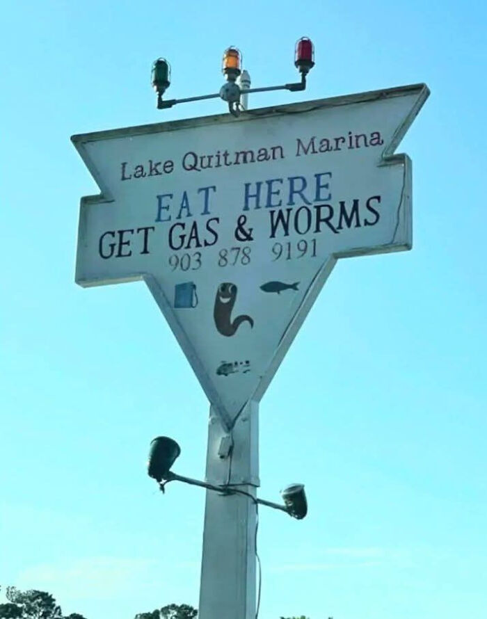 Vintage triangular roadside sign at Lake Quitman Marina with a humorous message that makes people laugh or do a double take.