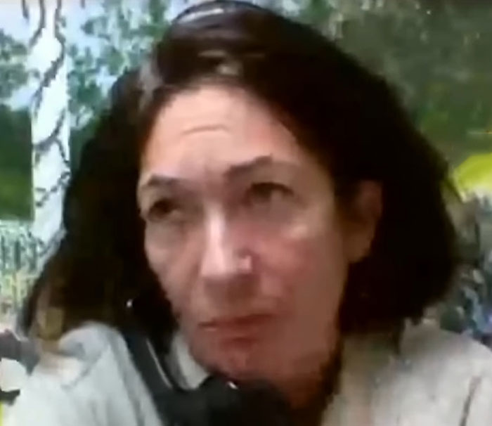 Ghislaine Maxwell in a close-up image with dark hair, outdoors, linked to prison job and heated public reactions.