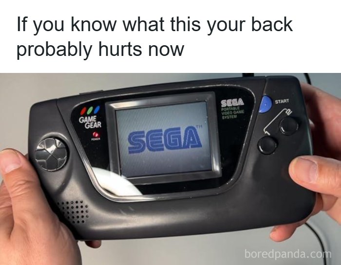 Hands holding a Sega Game Gear handheld console, a popular '90s gaming device showing parts of lives that don’t exist anymore.