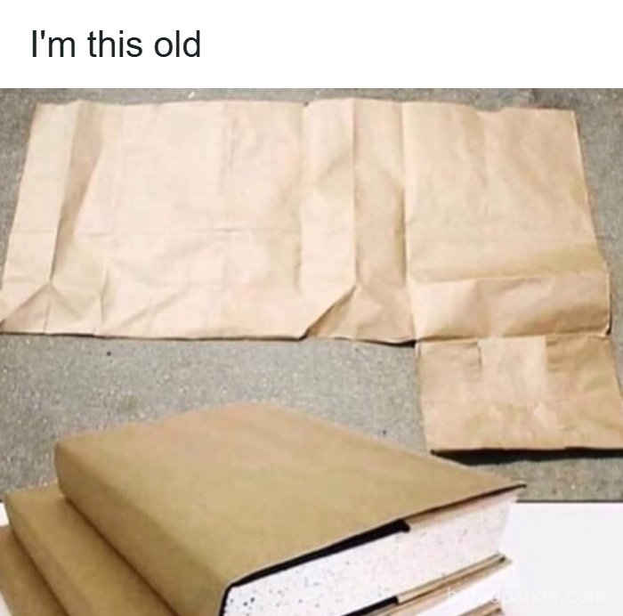 Brown paper bags unfolded and folded used to cover books, nostalgic for those attached to the 1990s and 2000s.