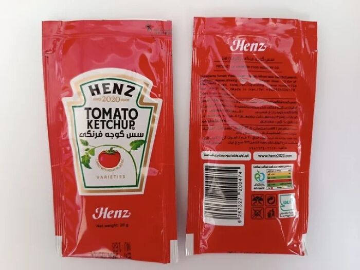 Red ketchup packets labeled Henz, mimicking Heinz branding, showcasing shameless designer copying of famous brands.