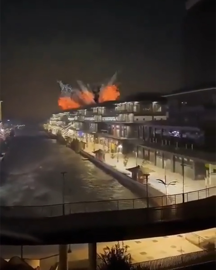 Explosion in Dubai at night with influencers filming amid Iran's Dubai strikes sparking public fury and outrage.