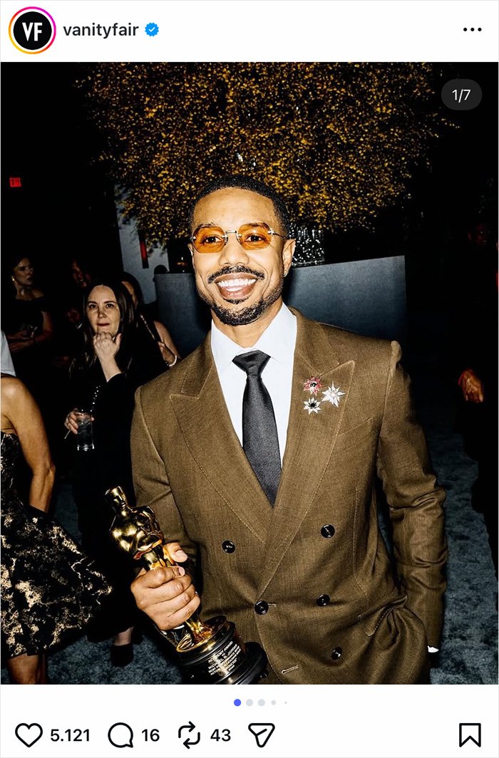 Man smiling and holding an Oscar statuette at an event, highlighting inside Timoth&eacute;e Chalamet&rsquo;s awkward Oscars night.