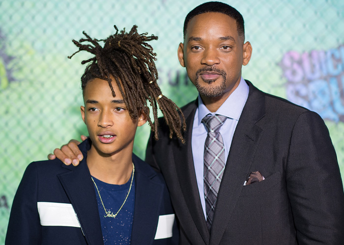 Will Smith and Jaden Smith posing together on the red carpet at a movie premiere event.