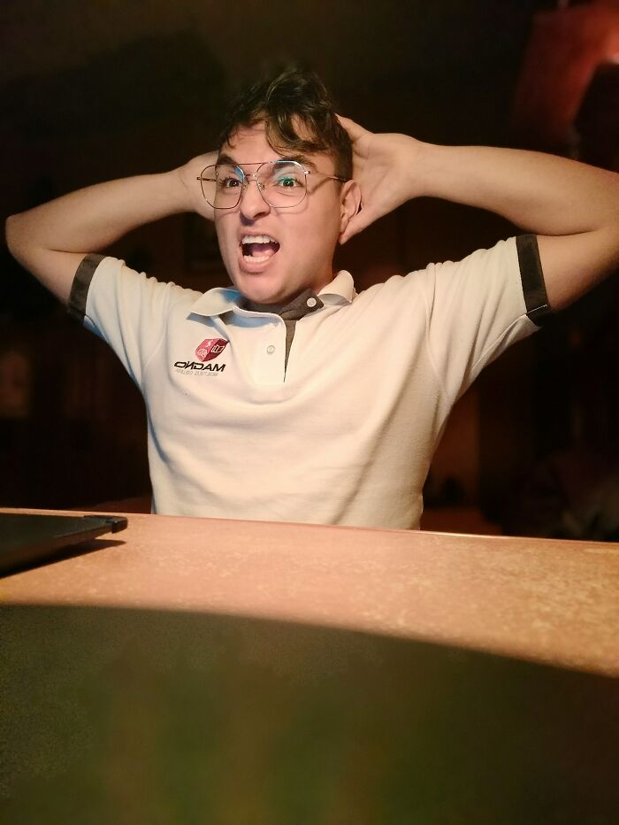 Young man in glasses making an expressive face, hands behind head, illustrating strong and on point comebacks.