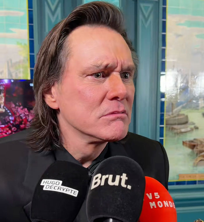 Jim Carrey with a new face, looking serious during an interview revealing details about his sadness and appearance.