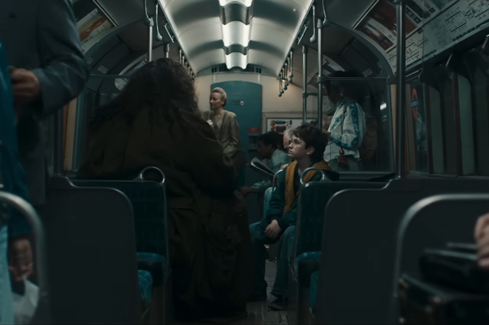 Scene from Harry Potter reboot showing passengers seated in a dimly lit train carriage amid the magical journey setting. Scene from Harry Potter reboot showing passengers seated in a dimly lit train carriage amid the magical journey setting.
