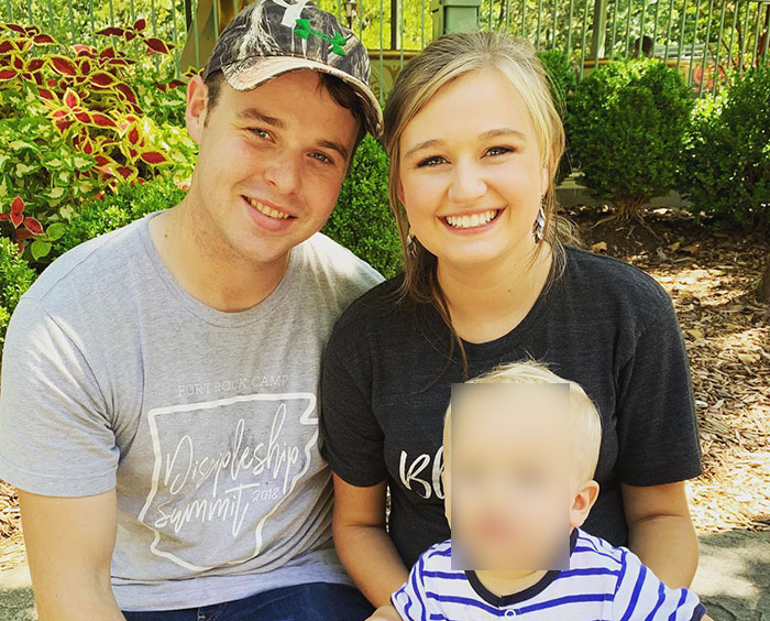 Young family posing outdoors with neighbor of Joseph and Kendra Duggar commenting on wife&rsquo;s arrest allegations.