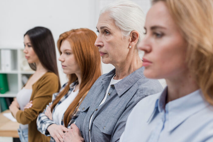 Former jurors in a jury room with serious expressions reflecting moments that made them lose faith in the justice system.