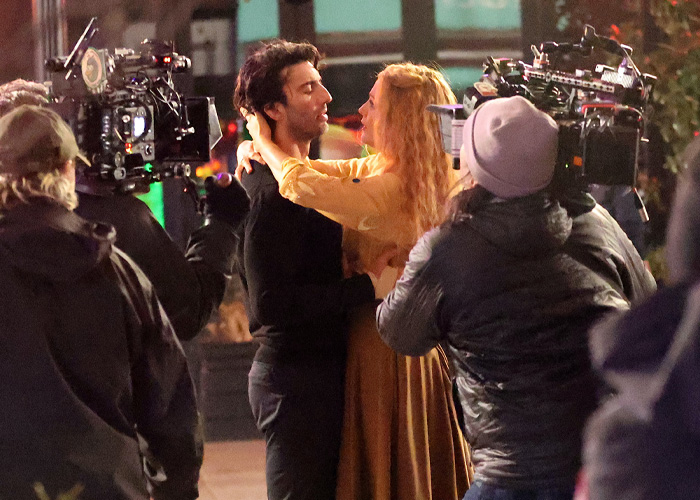 Justin Baldoni and Blake Lively filmed a dramatic scene surrounded by camera crew during legal battle news coverage.