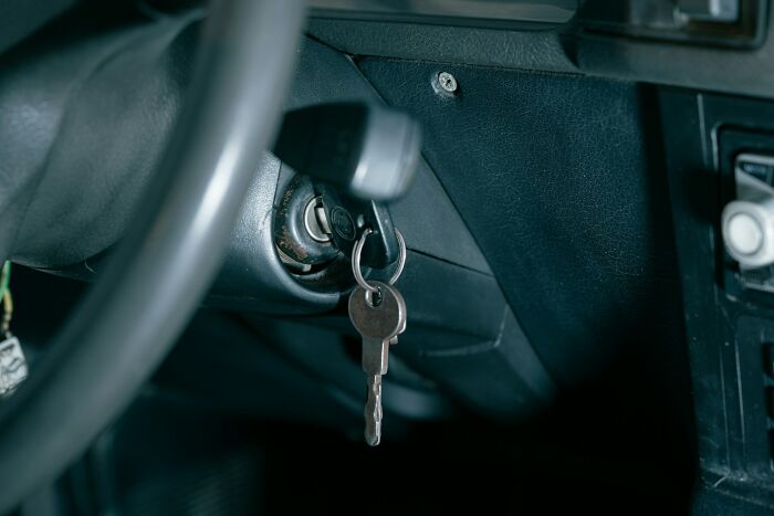 Car keys left in the ignition of an old vehicle, symbolizing moments of unexpected payback that feel almost wrong to enjoy.