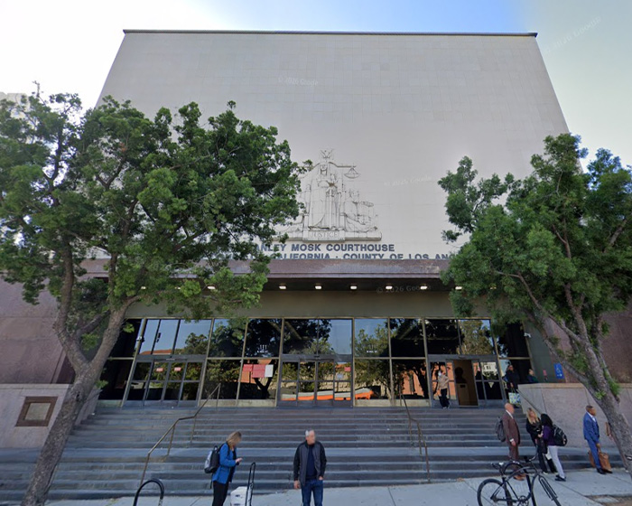 Los Angeles Stanley Mosk Courthouse exterior with people standing on steps, symbolizing concern about Prince Harry's hand movements.