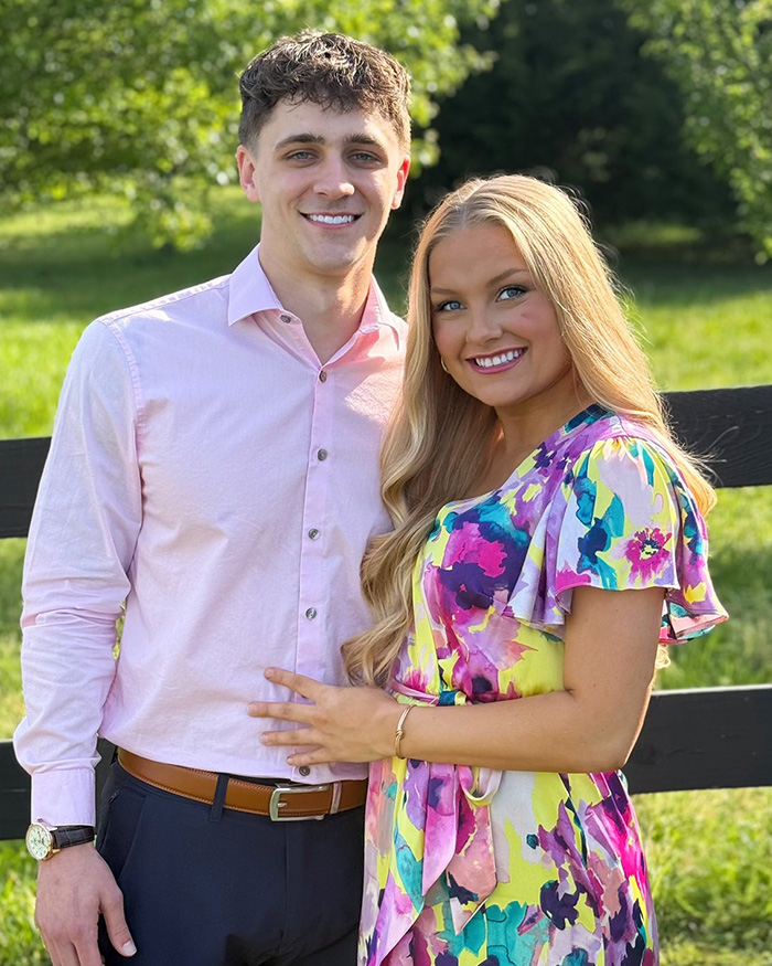 Young couple outdoors smiling, related to Laken Snelling's newborn baby's autopsy and Kentucky cheerleader manslaughter case.