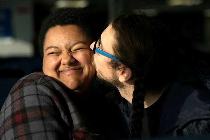 Two people sharing an affectionate moment, highlighting cultural differences people notice when visiting other countries.