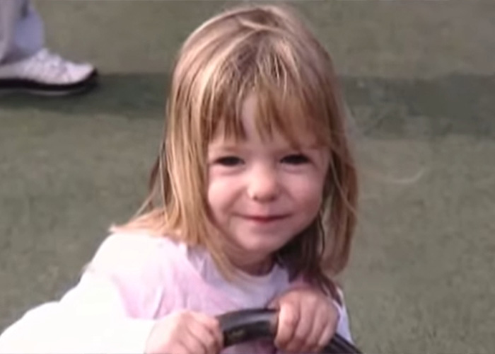 Young girl with blonde hair smiling outdoors in a major update in search for Madeleine McCann approaching anniversary.