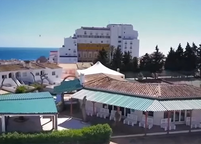 Scenic view of coastal buildings and a hotel near the site linked to the major update in Madeleine McCann search.